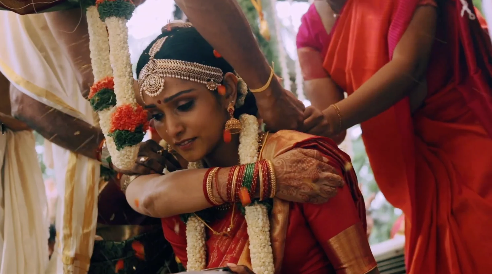 A wedding ritual unfolding, surrounded by family